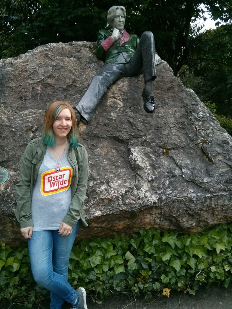 author with the Oscar Wilde statue in Dublin, Ireland